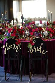 A wedding bouquet in ths shades of purple and lilac looks very soft and romantic. Colorful Weddings Bride Groom Wedding Party Able Decor Red Purple Pink Gold Kate Belle Photography Four Seasons Atlanta 61 Chicago Style Weddings