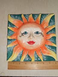 Glazed glossy finish with high sheen and uniform variation in tone; Ceramic Sun Face Wall Decor Hanging Pottery Folk Art Handmade Ceramic Sun Art 1803030206