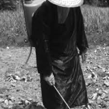 A volunteer modeling how each farmer wore the Locally Adapted PPE