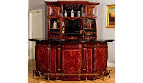 The beautiful beveled/tempered glass doors and raised panel drawer front are classically styled to enhance any home decor. Home Bar Furniture