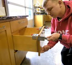 Shim the next cabinet even with the horizontal line and level it. Drawer Front Clamps Fastcap