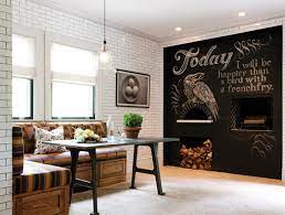 Family friendly dining nook boasts a u shaped dining banquette window doubling as window seat lined with gray cushions along with gray and green pillows facing a dining table fitted with bookshelves alongside a framed chalkboard mounted on wall. Chalkboard Accents In 15 Dining Room Spaces Home Design Lover
