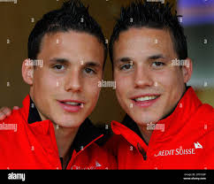 Swiss national soccer players, the twins David Degen, left, and Philipp  Degen, pose at a press conference in Feurisberg, Switzerland, Thursday May  25 2006 where they prepare with the squad for the