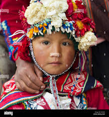 Portrait Of A Young Girl In An Ornate Hat; Cusco Peru Stock Photo