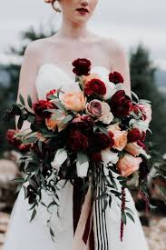 This is an early winter bouquet with snowberries, antique cabbage roses and the first dutch tulips of the season. Wedding Wednesday Fall Bouquets With Red Red Bouquet Wedding Wedding Bouquets Winter Wedding Flowers