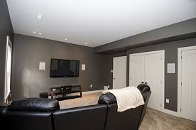 Stonewater Homes Theatre Room With Sectional Leather Coach Plush Carpet In Wall Surround Sound Speakers Pot Lights C Home Theater Rooms Home Theatre Room