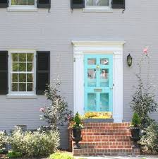 Example of a large classic entryway design in boston with a black front door and yellow walls our princeton architects designed this front porch addition to restore the home to its original. Love The Color Gingersutton Front Door Colors Aqua Front Doors Door Color