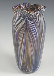 Beautiful on its own, or with a bouquet of flowers to enhance the colorful nature of the vase. Peacock Vase Rosetree Blown Glass