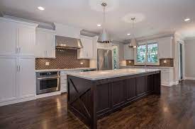 Pair it with sleek design aspects and you have an elegant blend of modern and natural aesthetic to create a contemporary and calming kitchen. Wonderful Two Tone Kitchen Cabinets Pictures Options Tips Ideas Dark Brown Cabinets Brown Kitchen Cabinets White Shaker Kitchen