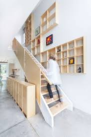 With some clever ideas given below, you can turn your useless under stair space into shelving units that shelves and racks store almost anything to help you keep your items arranged and organized. 12 Inspiring Examples Of Staircases With Bookshelves