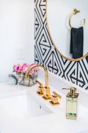 Bathrooms are the perfect place to start experimenting with wallpaper. Powder Room With Gold Mirror On Black And White Wallpaper Contemporary Bathroom