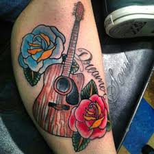 Eleanor scott recommends little blue's tattoos. Dreamer Un Tatuaje De Una Guitarra Con Flores Alrededor Tatuajesxd