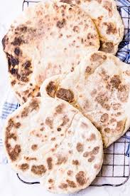 Miracle 2 Ingredient Naan Bread Creamy Greek Yogurt Mixed With Fluffy Self Raising Flour And A Pinch Of Salt Naan Bread Recipes Food
