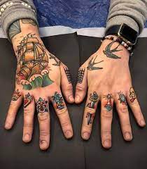 15 Unique Tattoos Of Modern Style For Shoulder And Arm The First Hand Fashion News For Females Hand Tattoos For Guys Traditional Hand Tattoo Finger Tattoos