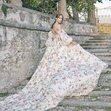 Pretty lady in gorgeous dress poses in park slow motion. 27 Floral Wedding Dresses