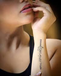 Conqueror Inscribed Within A Sword Side Wrist Tattoos Wrist Tattoos For Guys Sword Tattoos For Women