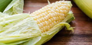 Place corn on a cutting board, and cut off the stalk end by making a shallow cut all the way around the corn and then slicing through. How To Microwave Corn On The Cob Kitchen Confidante