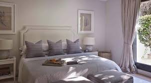 Jan 30, 2020 · the warmth of the light pink sheets and gold framed mirror finish things off with just a touch of contrast. Purple And Gray Bedroom With Stools At Foot Of The Bed Transitional Bedroom