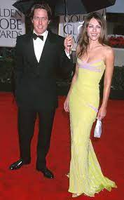 I always remember a versace one that gianni made. Hugh Grant Elizabeth Hurley From Golden Globes Couples Over The Years Elizabeth Hurley Hurley Dress Elizabeth Hurley Hugh Grant
