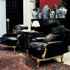 These Dark Leather Chairs Use Gold Accents To Show Off Rl S Designs The Prints In The Rugs And Vases Behind The Chairs Also Show Off Home Interior Home Decor