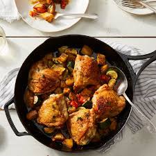 One Pan Crispy Chicken Thighs With Roasted Potatoes Zucchini Tomatoes Recipe On Food52 Recipe Crispy Chicken Thighs Skillet Chicken Crispy Chicken