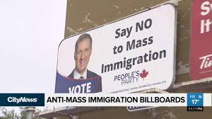 Ads featuring a photo of people's party of canada leader maxime bernier criticize mass immigration.. Anti Mass Immigration Billboards Up Across Canada