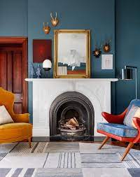 5 Living Rooms With Beautiful Fireplaces Nonagon Style Living Room With Fireplace Bohemian Living Room Decor Blue Walls Living Room