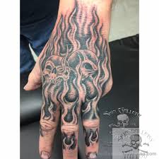 The skull tattoo represents one of the most iconic and versatile tattoo ideas for guys. Brentseverson Hand Tattoo Flames Fire Skulls Cover Up Black And Gray