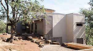 This Modern Net Zero Energy House Incorporating Age In Place Design Is Tucked Into The Ledges Along Th Energy Efficient Homes Design Build Firm Building Design