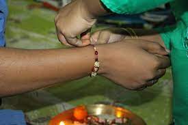 Borrowed from hindi राखी (rākhī, a rakhi), from sanskrit रक्षिका (rakṣikā, a rakhi), from रक्षा (rakṣā, care, guarding, preservation, protection; Raksha Bandhan Wikipedia