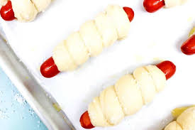 Separate the dogs with plastic wrap or parchment paper so they don't stick together and then put also, if you make a lengthwise incision in the hot dog, you can rip up a slice of cheddar cheese and wedge it in before wrapping the dogs up for cheesy. Easy Pretzel Hot Dogs A Dash Of Sanity