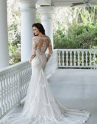 The fit and flare of a mermaid dress is never truly captured until you see it in a lace wedding dress. If You Were Not Already Loving The Tattoo Lace Trend This Dress Will Change Sincerity Bridal Wedding Dresses Sincerity Wedding Dress Wedding Dress Long Sleeve