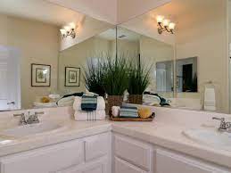 Including the vanity and assorted top, these sets offer the perfect balance between style and functionality. Two Large Vanities Meet In The Corner Creating An L Shaped Counter In This T Farmhouse Style Bathroom Vanity Bathroom Farmhouse Style L Shaped Bathroom Vanity