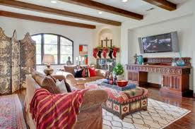 The whole room looks like a temple, with the niches in the walls, the arched windows and that. 18 Modern Moroccan Style Living Room Design Ideas