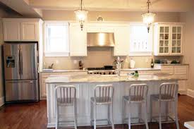 white kitchen cabinets with granite
