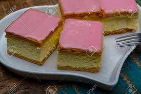 Tompouce is a traditional dutch pastry consisting of a thin puff pastry that is filled with cream and topped with a layer of smooth, pink icing. Tompoes Or Tompouce Iconic Pastry In Netherlands And Belgium Stock Photo Picture And Royalty Free Image Image 132322062