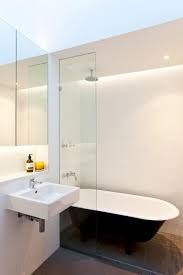 6 Design Trends Creating Modern Bathroom Interiors In Minimalist Style Modern Small Bathrooms Clawfoot Tub Shower Bathroom Tub Shower