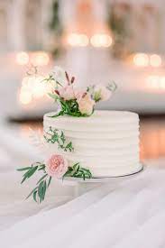 Even better, bringing flowers into your wedding cake design can help tie your décor together. Small White Wedding Cake With Pink Roses