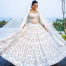 White bridal lehenga style ideas for brides who want princess look on wedding day. Ditch The Traditional Red And Go For Some Elegant White Bridal Lehenga This Wedding Season