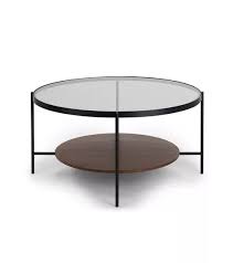 For added safety, choose a glass top with rounded edges so that guests will not accidentally cut themselves when they hit the table. 20 Small Round Coffee Tables To Maximize Your Tiny Space Coffee Table Round Glass Coffee Table Round Coffee Table