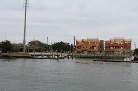 City staff gathered today to break ground on the new dock master facility at garrison bight. Developer And Dockmaster Partner Up Expand Size Of Wrightsville Beach Marina S Boat Slip Fleet Port City Daily