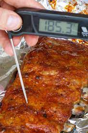 Checking The Internal Temperature Of Ribs And Getting A Reading Of 185 F Showing They Are Ready Baked Ribs Ribs In Oven Cooking