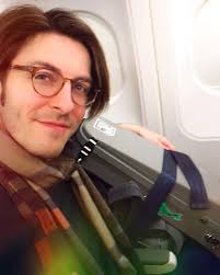 The theorbo is strapped in (yes, she gets her own seat) and we are