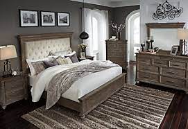 Find stylish home furnishings and decor at great prices! Johnelle Queen Upholstered Panel Bed Ashley Furniture Homestore