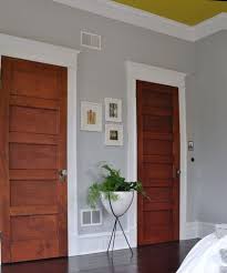 Love The Baseboards And Trim Around The Doors And The Crown Molding I Like White Doors Better Than T Wood Doors White Trim Stained Doors Grey Walls White Trim