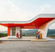 Modern Gas Station with Curved White Roof and Red Under ...
