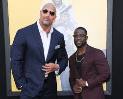 Born and raised in philadelphia, pennsylvania, hart began his career by winning several amateur comedy competitions at clubs throughout new england, culminating in his first real break in 2001 when he was cast by judd apatow for a recurring role on the tv series undeclared. Kevin Hart Update Dwayne The Rock Johnson Says He S Doing Very Well