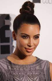 Kim kardashian﻿ debuted a major hair change on monday, taking to instagram to show off her new fire engine red hair to her followers. Kim Kardashian Bun Hairstyles Kim Kardashian Top Knot Hair