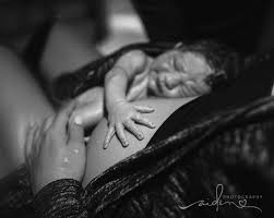 Photos capture exact moment dad delivers baby in front seat of car