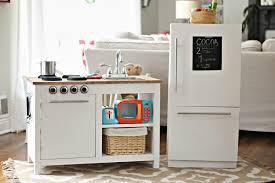 The ground is dug out underneath this part of the structure to give the appearance of it effortlessly floating. Modern Farmhouse Kids Kitchen Set Sincerely Marie Designs